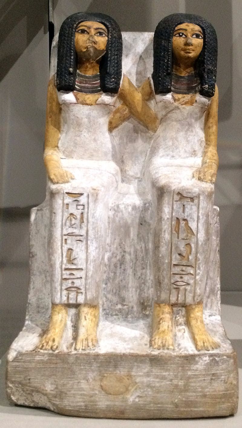 Sculpture of two Egyptian women embracing